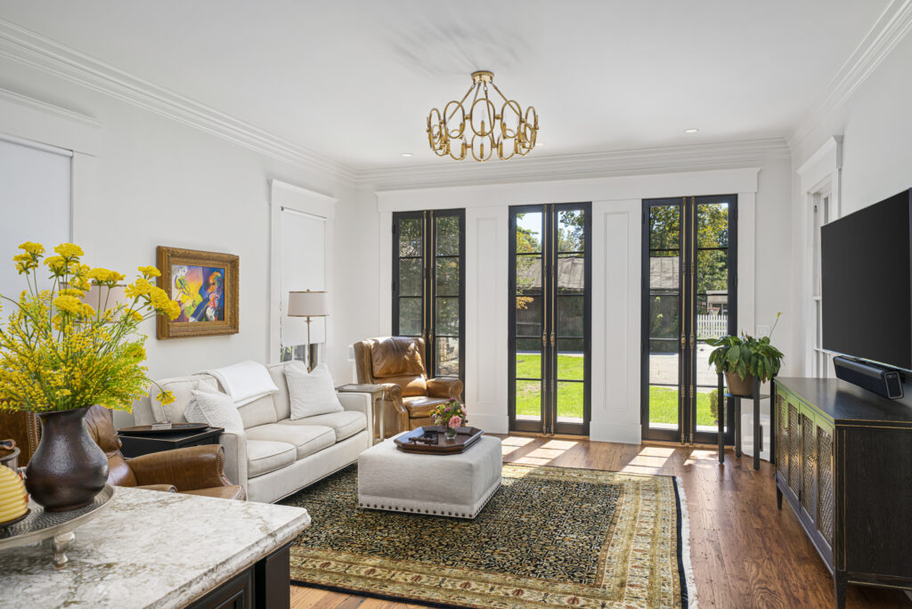living room with black french doors