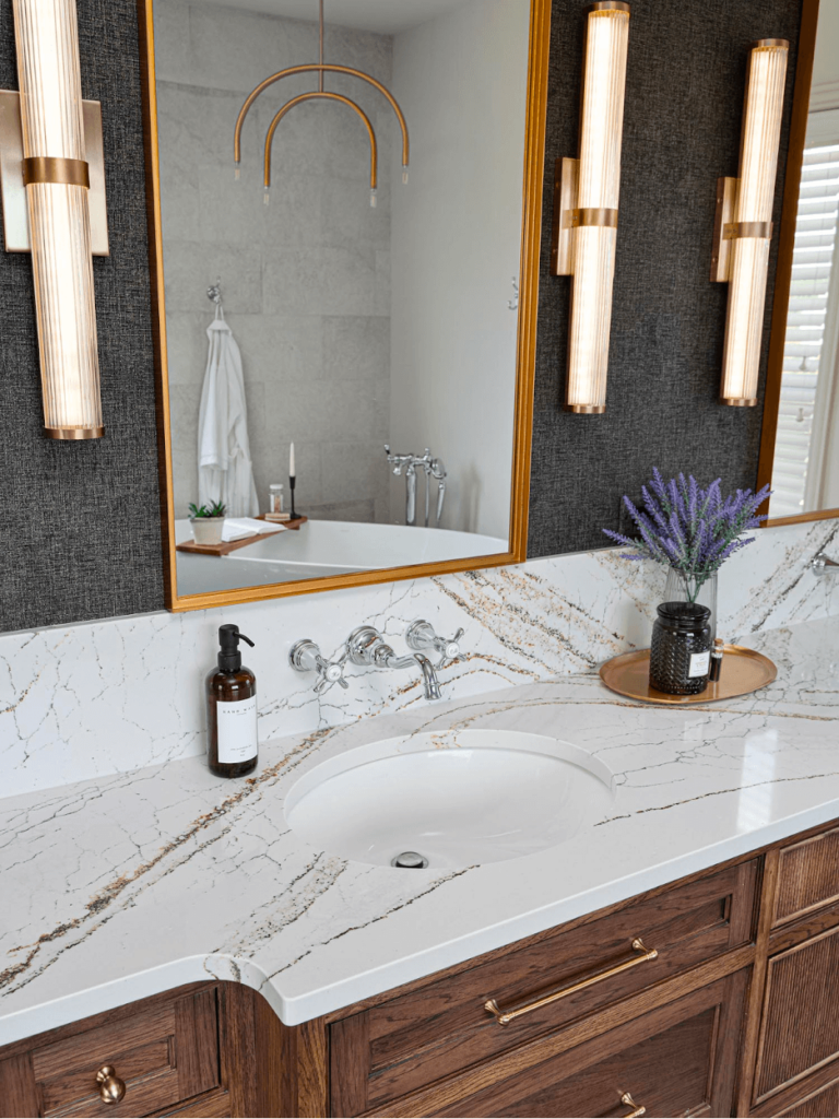 A bathroom vanity with a beautiful quartz countertop.